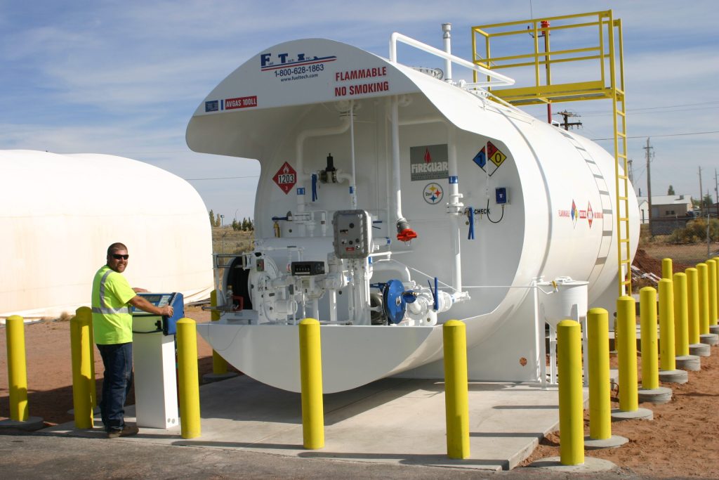 Photo by Daniel Adamovich, PhDHolbrook City Manager Randy Sullivan shows off the new fuel farm tank that has been installed at the Holbrook Municipal Airport. The city relocated the fuel farm closer to the entrance of the airport for the convenience of the pilots.