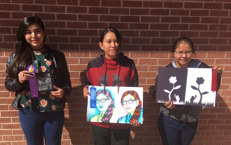 Photo courtesy of Holbrook High SchoolThree Holbrook High School art students participated in the 2nd Annual Methodist Youth Ministries Native American Youth Art Show that was held on Oct. 7 at the Navajo County Fairgrounds. The students (left to right) Stacey Jackson, Jolene Ayze and Valtavia Cook were winners in the painting and drawing category. Stacey received Best in Show for her charcoal drawing of a cowboy, receiving a $100 gift certificate to Walmart. Jolene captured first place with her Warholesque self-portrait and garnered a $75 gift certificate. Rounding out the group was Valtavia who finished in second place for her collage and in third place for her Flower Notan piece and received $75 in gift certificates for her efforts.