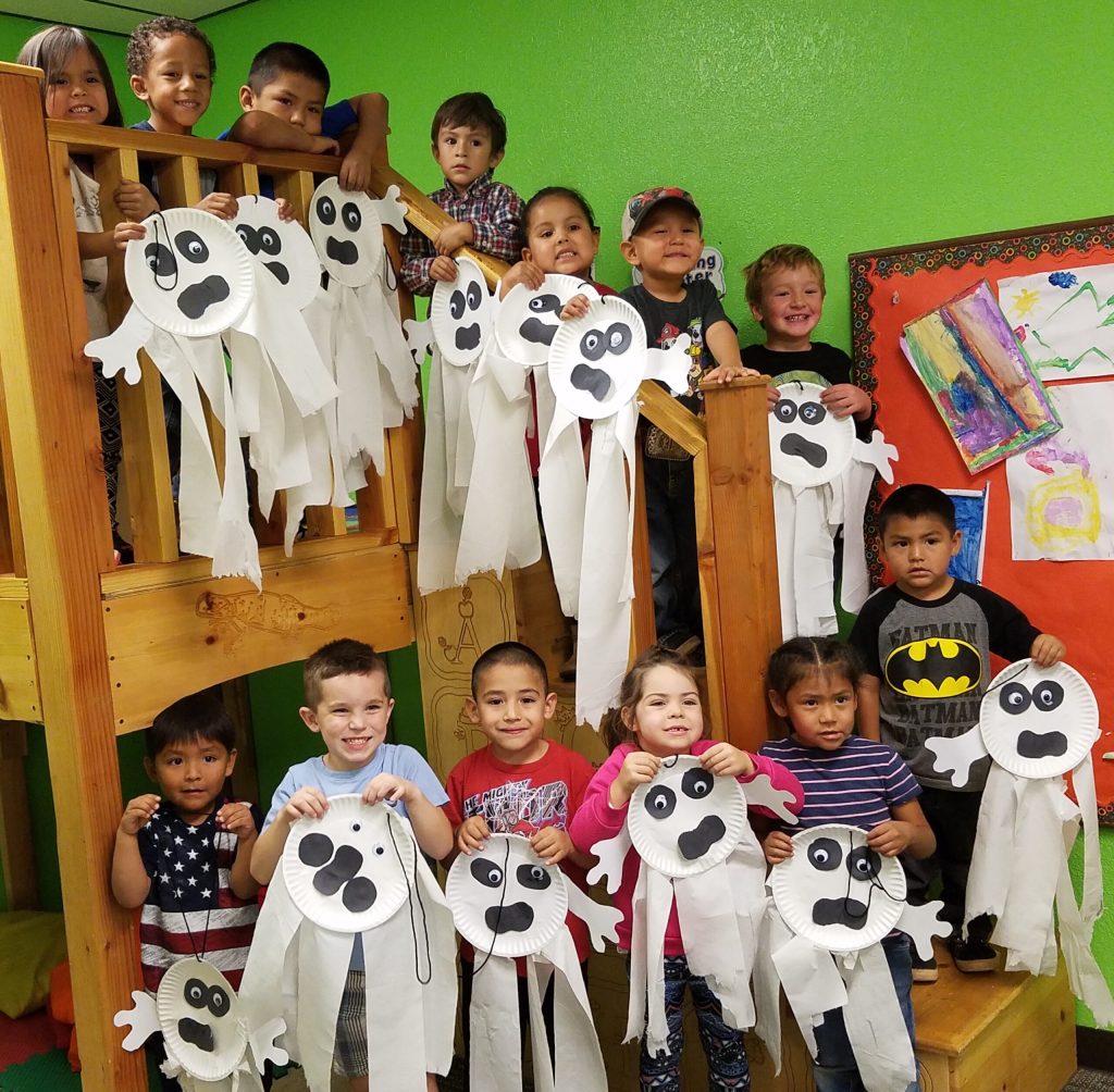 Photo by L. Parsons Members of the preschool class at the Imagination Station in Winslow, including (front row, left to right) Domani Nez, Brockton Lozano, Benjamin Guzman, Kayla Kilburg-Way, Kiona Frank, (back row) Jordan Begay, Antoine Lynch, Damien Frank, Skylar Aguilar, Natalia Palty, Kolter Salazar, Stratton Salyers and Damekko Frank, show off their Halloween crafts. The kids learned ghost making, Jack-O-Lantern painting and “scary” stories as they prepared for the fun on Tuesday, Oct. 31. The class will have a costume party complete with treats and games.