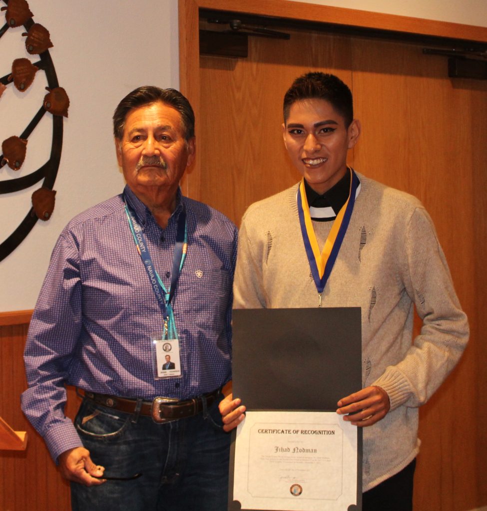 Photo by Toni GibbonsJihad Nodman (right), a junior from Hopi High School, was presented a certificate of recognition by Supervisor Jesse Thompson (left) at the Navajo County Board of Supervisor’s meeting on Nov. 28. The certificate was given in honor of Jihad winning second place in Division 4 cross country at the 2017 Arizona Interscholastic Association State Cross Country Tournament on Nov. 4, with a time of 16:46.