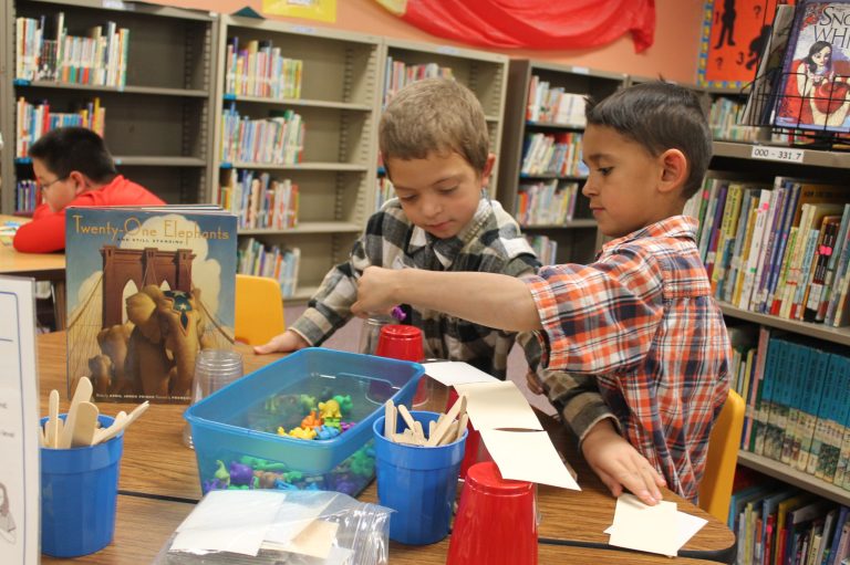 Brendan Derrick (left) and Elijah Kenowski (right) learn about building bridges in the hands-on Arizona Science Center Extravaganza at Park Elementary School.
