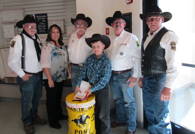 Photo by Diana HutchisonThe Hashknife Posse is preparing for its 60th Pony Express ride by placing the mail barrels out with one at the Holbrook, Winslow, Snowflake, Taylor, Show Low and Pinetop post offices. Pictured at the Holbrook Post Office are, (left to right) Jim Mobley, Postmaster Loretta Short, Bill Perkins, Waylon Miller, Jerry Young and Tim Kelley. The posse is collecting mail for its annual Pony Express Ride over the Mogollon Rim to Scottsdale, which will begin on Wednesday, Feb. 7.