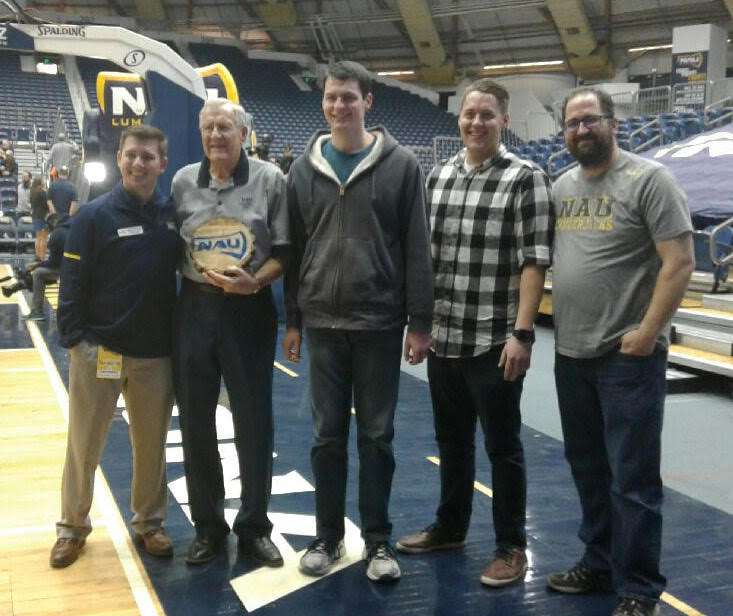 Photo courtesy of Celeste FisherFrank Turley (second from left) was honored by NAU for his legacy as an NAU Lumberjack. Also pictured are (left to right) NAU Athletics Director of Development Derek Petruskevich, and Turley’s grandsons Caleb Rogers, Kyler Farr and Eldon Ferguson.