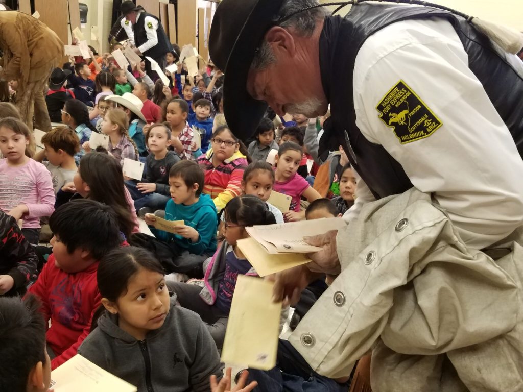 Photo by L. Parsons Hashknife Pony Express letter carrier Walter Pacheco of Winslow collected letters from first and second grade students at Jefferson Elementary School in Winslow last Friday. Students wrote letters to be carried by the Hashknife Posse on their 60th Hashknife Pony Express ride from Holbrook to Scottsdale.