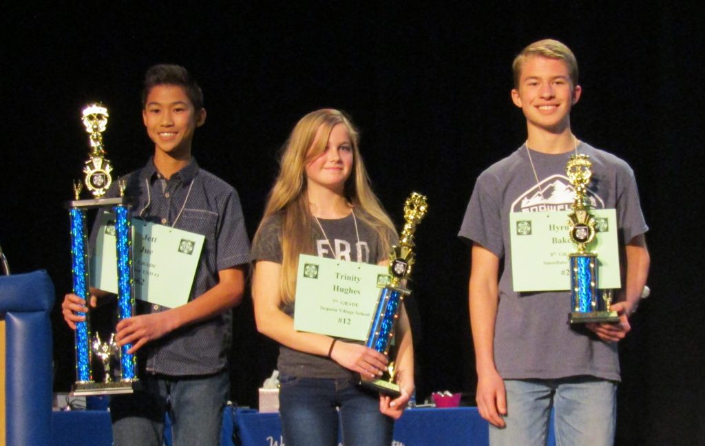 Photo by Diana HutchisonThe 2018 Navajo County Spelling Bee was held on Feb. 14 at the Snowflake High School auditorium. After 14 rounds of competition, it came down to these final three students. Pictured here is first place winner Jett Jue (left), second place winner Trinity Hughes (middle) and third place winner Hyrum Baker (right).