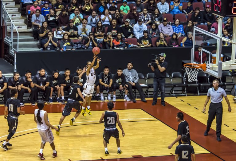 Photo by Richard LarsonBulldog Theron Olney goes for the shot as the Winslow team takes a victory over the Chinle Wildcats, 68-57.