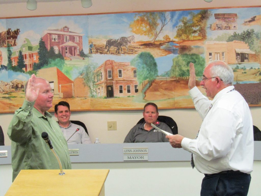 Photo by Diana HutchisonThe Snowflake Town Council welcomed Greg Brimhall (left) as the newest member of the council. Judge Fred Petersen (right) swore in Brimhall during the council meeting. Also pictured are Councilman Hunter Lewis (second from left) and Mayor Lynn Johnson (second from right).