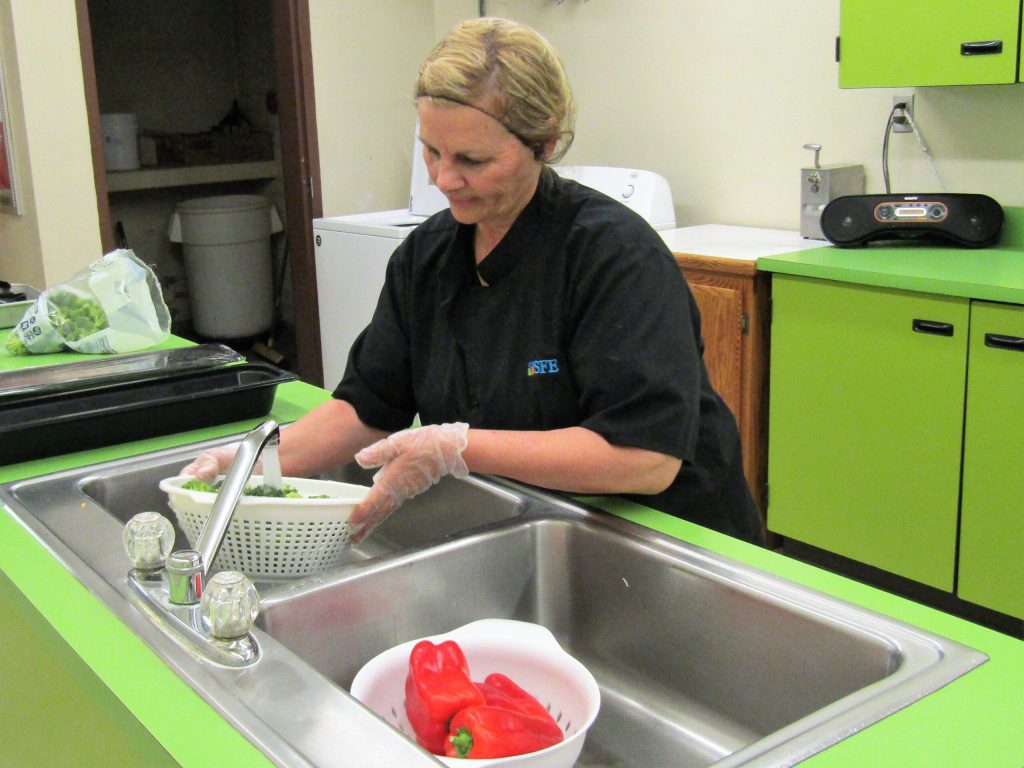 hoto by Diana HutchisonTaylor Elementary School food service worker Cheryl Patten prepares fresh vegetables for the salad bar available for students everyday for lunch. All schools within the Snowflake Unified School District have a salad bar.