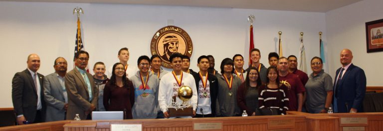 Photo by Toni GibbonsNavajo County Board of Supervisors take a moment to honor the recent victory of the Winslow High School Bulldogs Basketball team on Mar. 13.