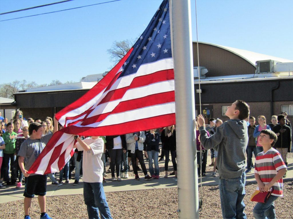 Photo by Diana HutchisonLast week, Snowflake Intermediate School had a flag retirement ceremony. Principal Kim Lewis spoke to the students about respecting the flag. Fifth graders from Brandi Peterson’s class performed the ceremony. Students Veronica Ayers, Kinlee Cates and Anahi Camacho took down the old tattered flag. Students then raised a brand new United States flag and State of Arizona flag as the entire school witnessed. Students pictured here are (left to right) Brock Bjorn, Owen Rhoton, Branson Mills and Zaydn Salerno.
