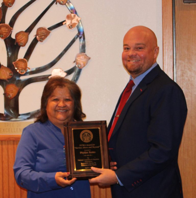 Photo by Toni GibbonsNavajo County Supervisor Jason Whiting (right) presented Constable Phyllis Romo (left) with a certificate recognizing the award she received from the National Constables and Marshals Association on April 6 for ‘Service Above and Beyond.’