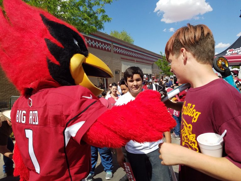 Photo by L. ParsonsArizona Cardinal’s fans of all ages were excited to receive autographs from alumni, cheerleaders and Big Red. The mascot signed jerseys and other Cardinal’s memorabilia and even Zach Bortz’s (right) scooter as his friend Julien Davis (center) looks on.