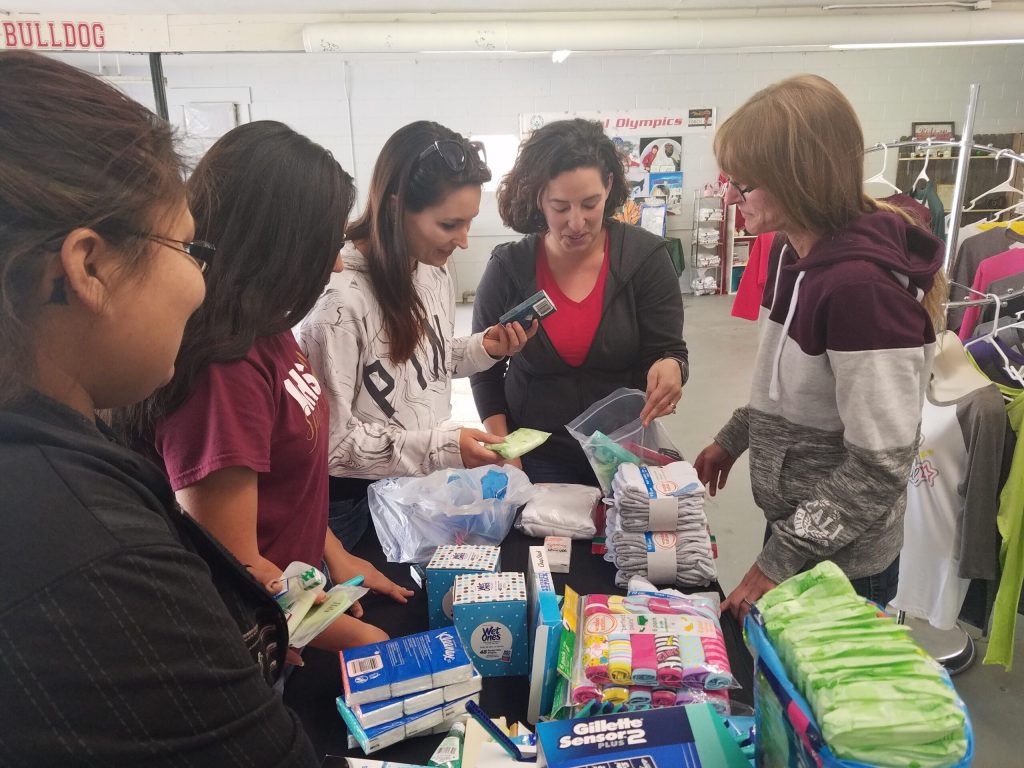 Photo by L. ParsonsMembers of the group, Tinder Fire Donation Crew, met at Small Town Dreams located on West Second Street last week to put together toiletry kits for victims of the Tinder Fire. Pictured are (left to right) Karen Caughey, Aiyanna Amich, Gina Gose, Laura Carrell and Samantha Crisp.