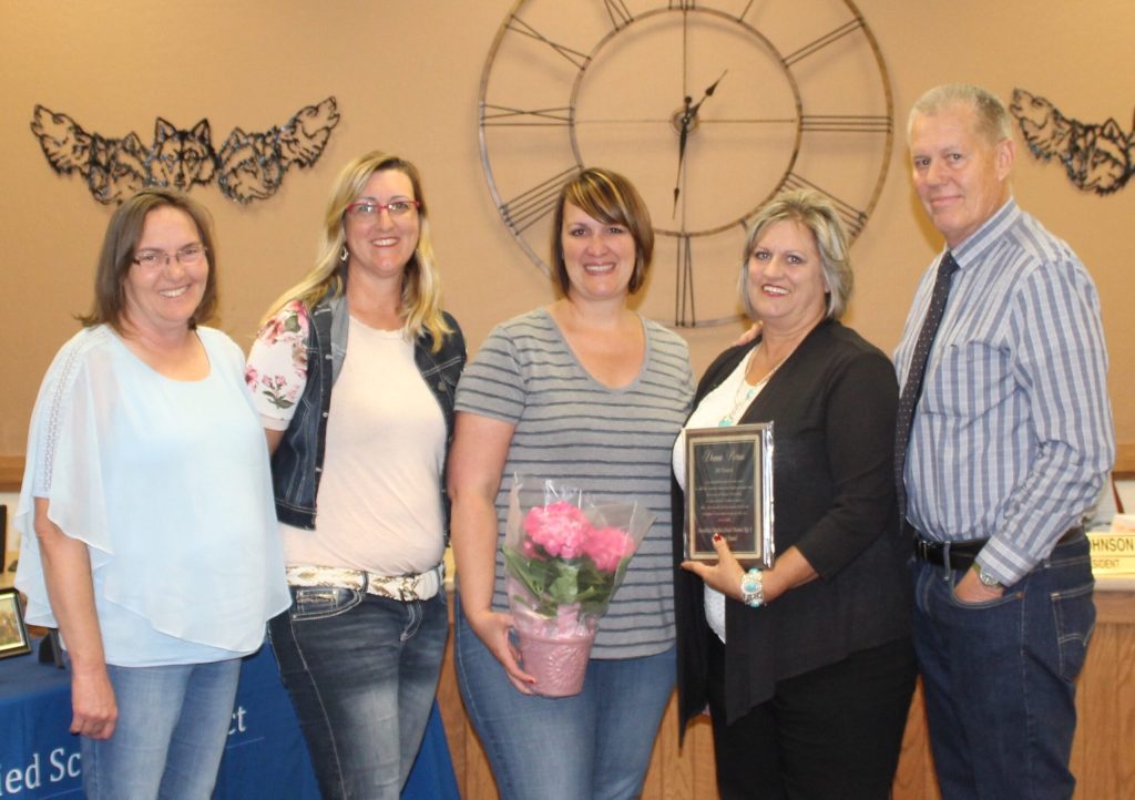Photo by Toni GibbonsFellow teachers from the Snowflake Intermediate School gave retiring fourth grade teacher Donna Porras (second from right) a beautiful plant during the celebration honoring her 30 years as a teacher at the Snowflake Unified School District meeting on May 10. Also pictured are teachers, Tina Evans, Kimberly Scott, Stacy Ward and Snowflake Intermediate School Principal Kim Lewis.