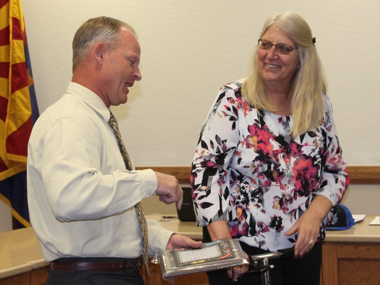 Photo by Toni GibbonsHighland Elementary Principal Roy Owens (left) took a moment to thank third grade teacher Sheri Brown for her 39 years as a teacher during an awards ceremony on May 10.