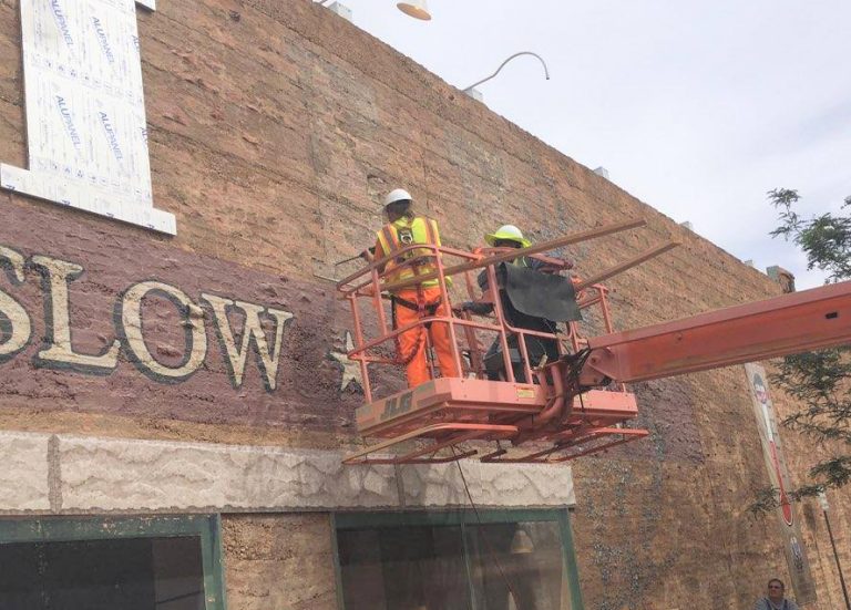 Photo by Greg HacklerCity workers and a crew from the Winslow Complex removed panels of the mural in the Standin’ On The Corner Park at Second Street and Kinsley Avenue for restoration. It is estimated at the restoration will cost about $30,000, with $15,000 raised so far by organizers.