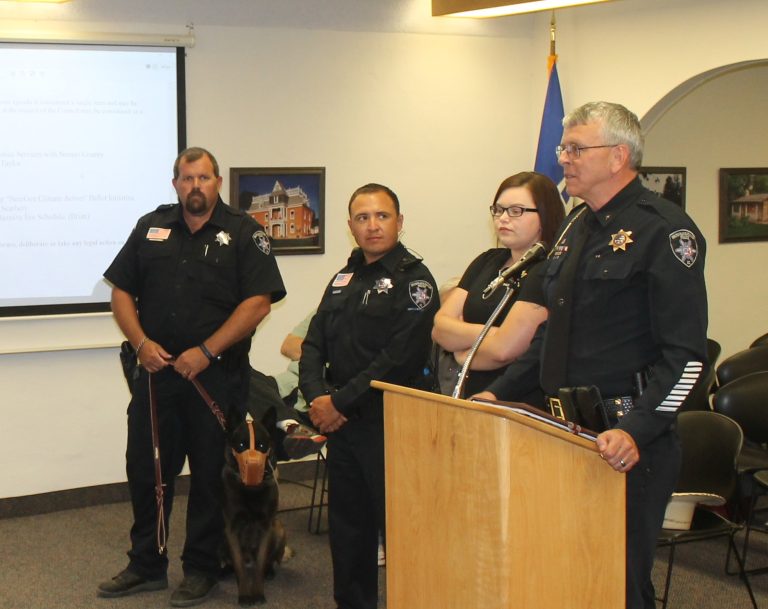 Photo by Diana HutchisonSnowflake Taylor Police Department Chief Larry Scarber (right) presented ribbons to (left to right) K-9 Officer Jeff Whipple, K-9 Doc, Officer Moses Ramos, and dispatcher Brittany Liston for completing crisis intervention training.