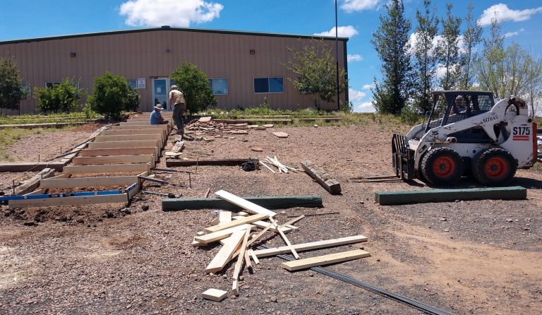 Photo by Diana HutchisonNorthern Arizona Academy, a charter high school in Taylor, is getting a brand new concrete walkway in time for the new school year. Last week, workers with Spires Concrete Worx were busy building the forms to get ready for the concrete. The new steps will be much safer and more attractive than the old railroad ties.