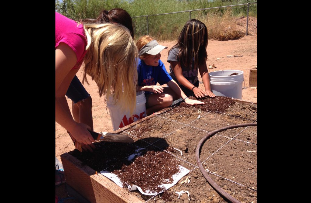 Photo courtesy of Park Elementary SchoolStudents taking part in the STEM Gardening Club prepare soil in a raised bed at Park Elementary School.