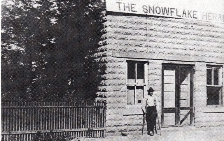 Photo from the book ‘From Indian Trails to Jet Trails’The Snowflake Herald had its start in this block building in 1913. Pictured is the editor at the time “Deacon” Jones.