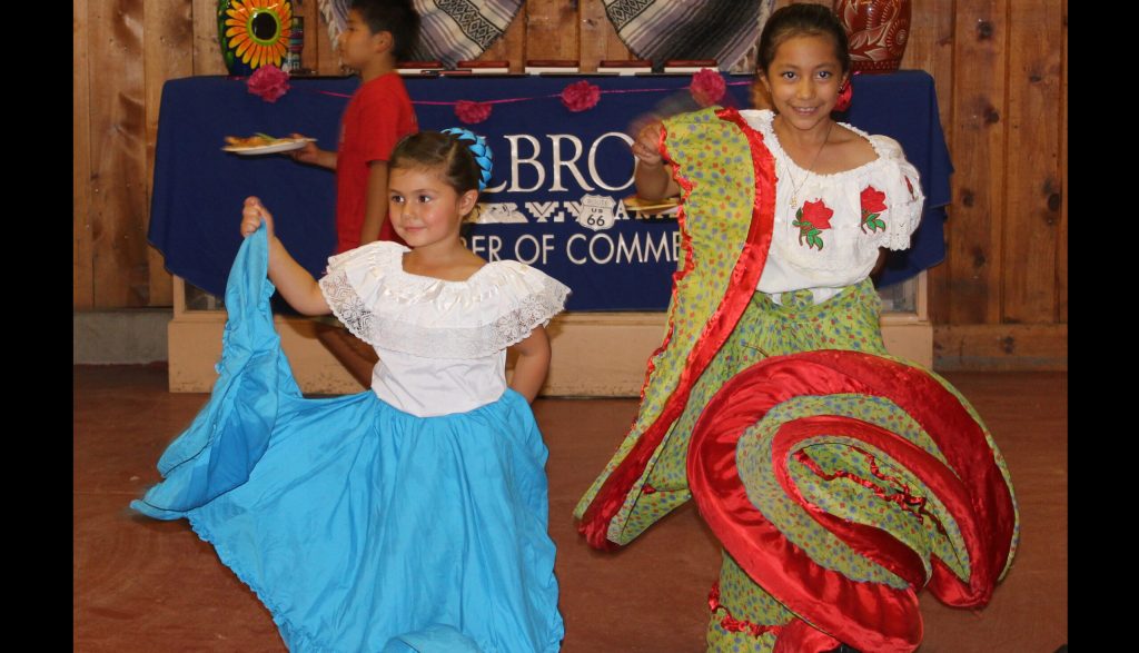 Photo by Toni GibbonsBrielle Mondragon (left) dances with Krystal Aguilar at the Taste of Holbrook hosted by the Holbrook Chamber of Commerce on July 26.
