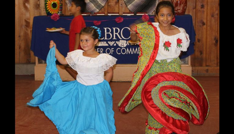 Photo by Toni GibbonsBrielle Mondragon (left) dances with Krystal Aguilar at the Taste of Holbrook hosted by the Holbrook Chamber of Commerce on July 26.