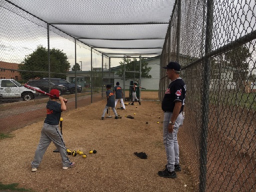 Photo courtesy of APS staffFormer Major League Baseball Player Lou Klimchock (right) teaches batting techniques to the kids who participated in the Arizona Public Service All-Star Clinic at Winslow’s Little League Field on July 23.