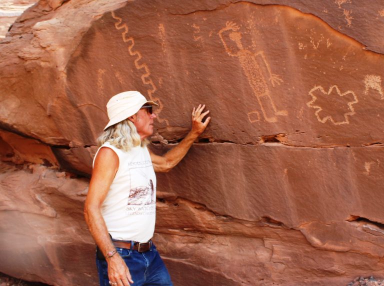 Photo by Toni GibbonsMike O’Dell, a Holbrook City employee and tour guide for Hidden Cove Petroglyph Park, talks about Cliff the Glyph, or Sky Watcher Cliff, the most popular rock art figure at the Hidden Cove Petroglyph Park.