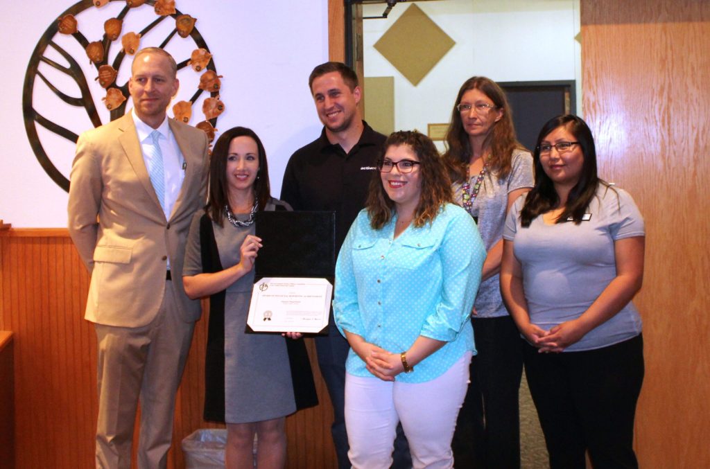 Photo by Toni GibbonsNavajo County Assistant Manager Bryan Layton (left) recognized Finance Director Paige Peterson (second from left) and members of the Finance Department for receiving a Certificate of Achievement for Excellence in Financial Reporting on Aug. 14. Also pictured are (left to right) Account Specialist Ryan Larson, Finance Operations Supervisor Rebecca Robertson, Accountant Jackie Walker and Account Specialist Sonya Martin.