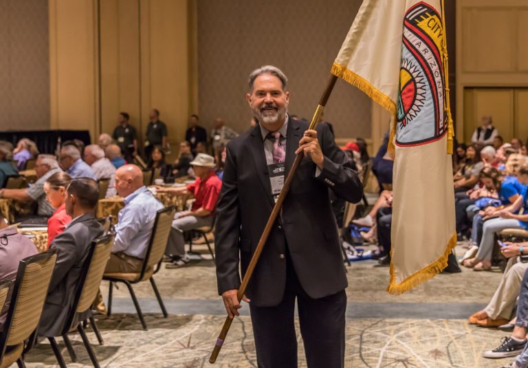 Photo by Steve PaukenMayor Tom McCauley carried Winslow’s flag in to the 2018 League of Arizona Cities and Towns Conference held last week in Phoenix.