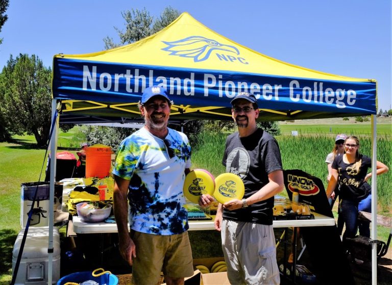 Photo by Tom PoscharskyScholarship Disc Golf Tournament Director Steve Johnston (left), a Professional Disc Golf Association Pro Grand Master, takes a photo break with Northland Pioneer College (NPC) President Mark Vest (right) at the disc golf tournament, which was put on by NPC Friends and Family to raise money for scholarships.