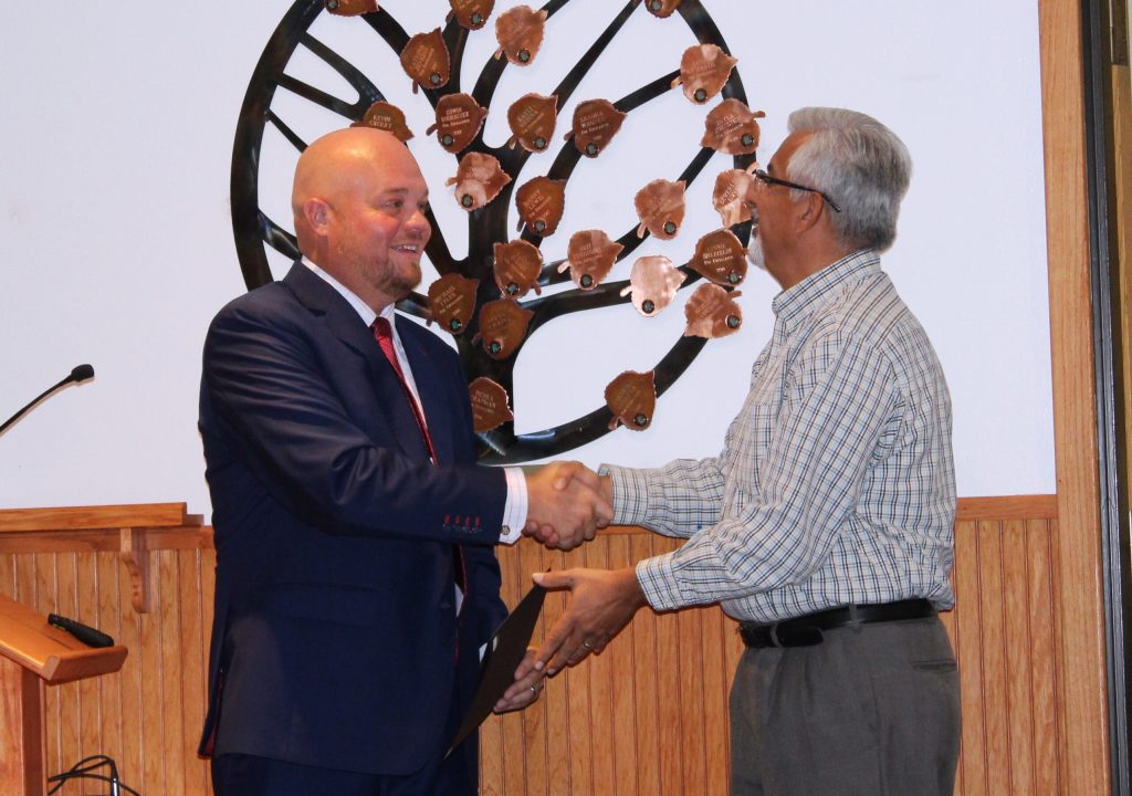 Photo by Toni GibbonsNavajo County Board Supervisor Jason Whiting (left) presents Michael Sample (right), president of the Navajo County Fair Board with a proclamation declaring Wednesday, Sept. 12, through Saturday, Sept. 15, as Navajo County Fair Days at the Board of Supervisors meeting on Aug. 28.