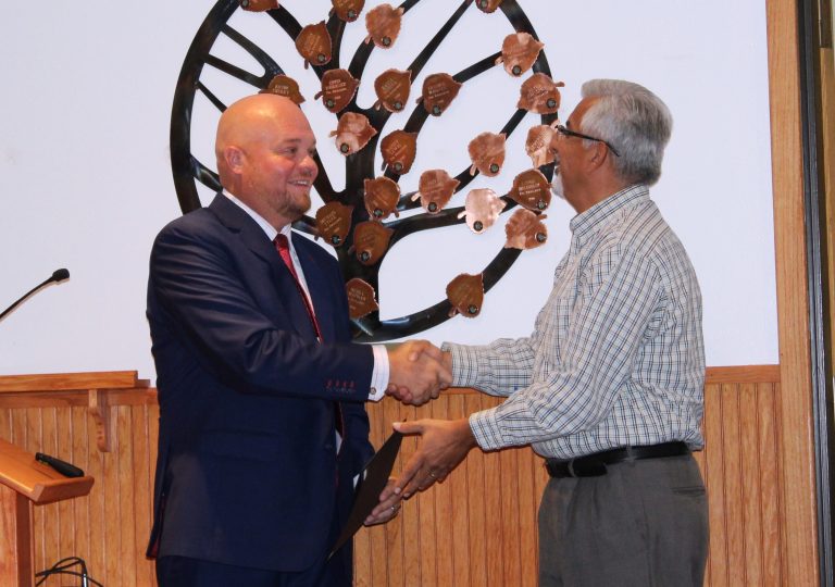Photo by Toni GibbonsNavajo County Board Supervisor Jason Whiting (left) presents Michael Sample (right), president of the Navajo County Fair Board with a proclamation declaring Wednesday, Sept. 12, through Saturday, Sept. 15, as Navajo County Fair Days at the Board of Supervisors meeting on Aug. 28.