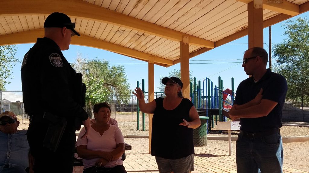 Photo by L. ParsonsWinslow Police Chief Dan Brown (left) and Public Works Director Tim Westover (right) listened as Coopertown resident Sandra Vasquez (center) explained the need for traffic control while other residents looked on.