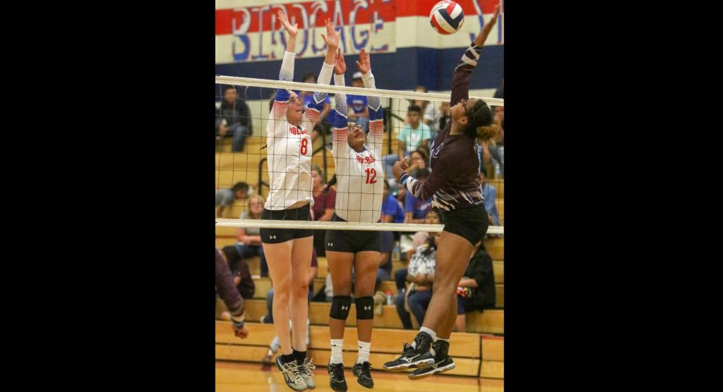 Photo by Kellie Spangler/SpangerpicsThe Holbrook girls’ volleyball team went up against the Ganado Hornets last week. Here Sydney Plumb (left) and Shaylynn Begay (center) block a spike by an opposing team member.