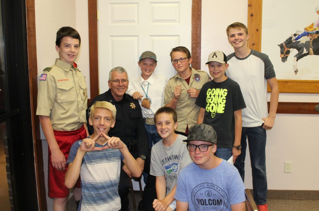 Photo by Toni GibbonsMembers from Snowflake Boy Scout Troop 705 talked with Chief of Police Larry Scarber after the Taylor Town Council meeting on Sept. 6. Pictured are (front row, left to right) Derick Ortiz, Dallin Weech, Randy Aubin, (back row) Jantzen Tenney, Chief Scarber, Charles West, Logan Brimhall, Justin Traver and Rhett Westbrook.