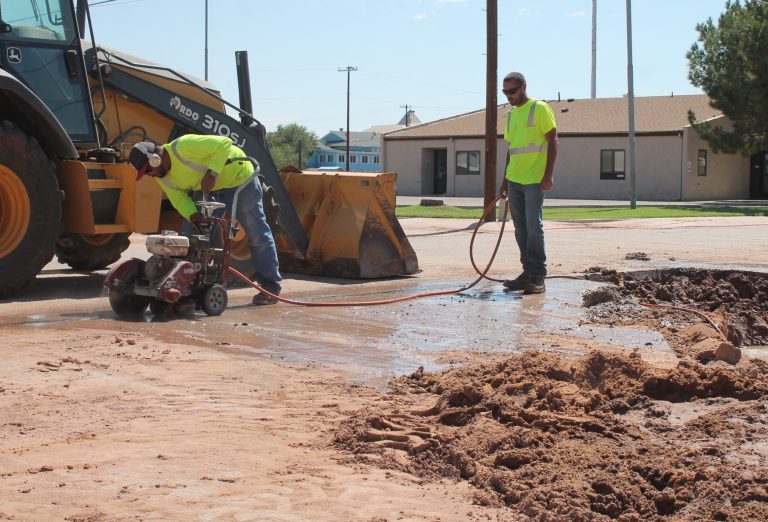 Photo by Linda KorA broken water main last week on First Avenue next to Holbrook City Hall had Oscar Chairez (left) and Josh Johnson (right) busy. On Monday crews began to chip seal streets including East Florida, East Iowa, East Joy Nevin, Mariana, Anita and Encanto. The work will continue through Friday and residents are asked to have all vehicles, trailers, trash containers and all other items off the street. For more information, contact City Hall at (928) 524-6225.