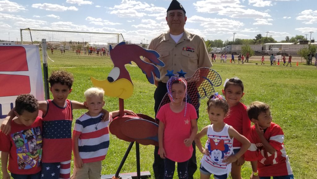 Park Elementary School kids learn about patriotism from veteran Alex Baker (back row). Students taking part included (front row, left to right) Trace McPherson, Rayce Alley, Bentley Gardner, Audrey Yazzie, Kaylin Charley, Kenzie Romo and Christopher Gurule.