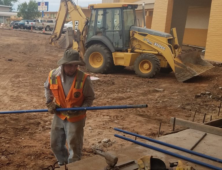 Photo by L. ParsonsThe parking lot at the Winslow Police Department, located at 708 W. Third St. is getting a complete makeover. The lot, which holds employee as well as visitor vehicles has been slated for improvement since 2017 when the project was placed in to the capital improvements budget. The overall project, which includes repaving of the lot and releveling and pouring of the sidewalk, is expected to cost between $100,000 to $200,000. Pictured is McCauley Construction employee Steffen Bailon.