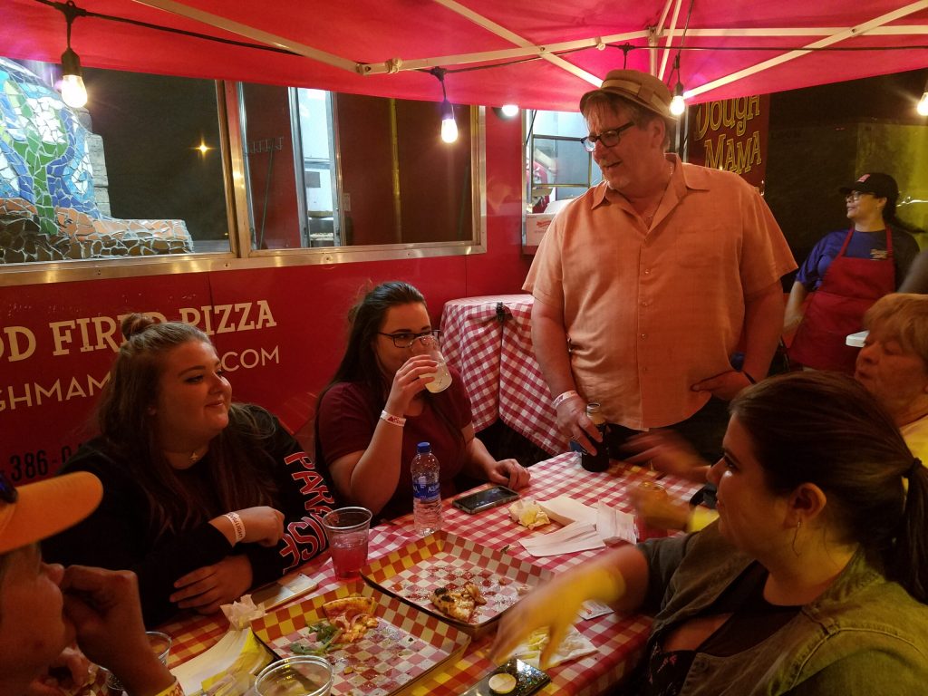Photos by L. ParsonsFamilies and friends enjoyed the festival together including this group. Winslow Chamber of Commerce CEO Bob Hall (standing) visited with nieces and friends from out of town. Also pictured are (left to right) Miranda Johnson Rachel Butler, Rachel Streetman and Sue Kislingbury.
