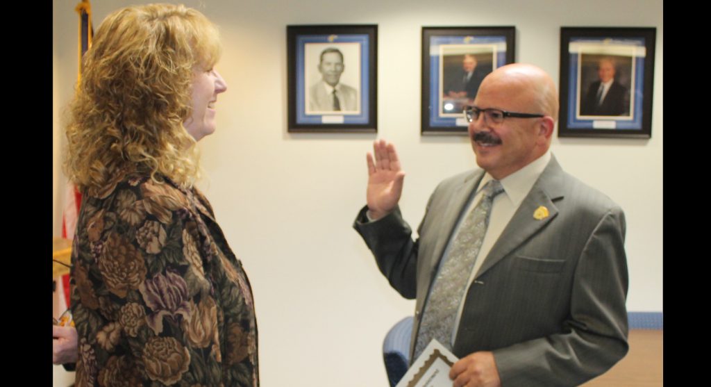 Photo by Linda KorWinslow resident Elias Jouen (right) was sworn in by Navajo County Superintendent of Schools Jalyn Gerlich (left) as the newest member of the Navajo County Community College Governing Board on Oct. 12. Jouen is also employed as the business manager for the City of Winslow. The term for his position will be until December of 2020.