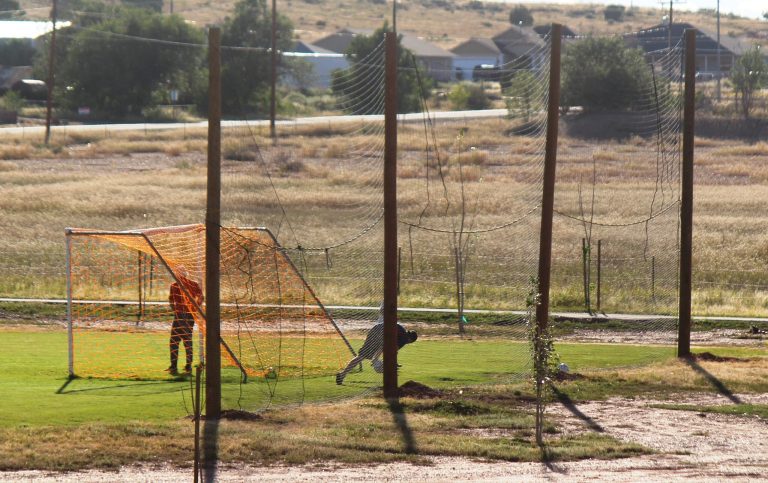 Photo by Toni GibbonsPlayers practice their moves in the late afternoon on the soccer field at Freeman Park in Taylor that now sport telephone poles and netting to keep the balls contained on the fields.