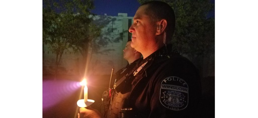 Photo by L. ParsonsThe community of Winslow gathered earlier this month for a candlelight vigil dedicated to the victims and survivors of domestic violence. Those in attendance included Winslow Police officers Shane Robertson (right) and Corey Benoit (left).