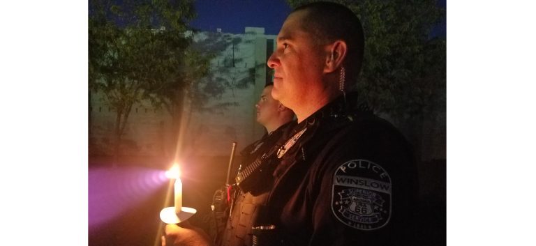 Photo by L. ParsonsThe community of Winslow gathered earlier this month for a candlelight vigil dedicated to the victims and survivors of domestic violence. Those in attendance included Winslow Police officers Shane Robertson (right) and Corey Benoit (left).
