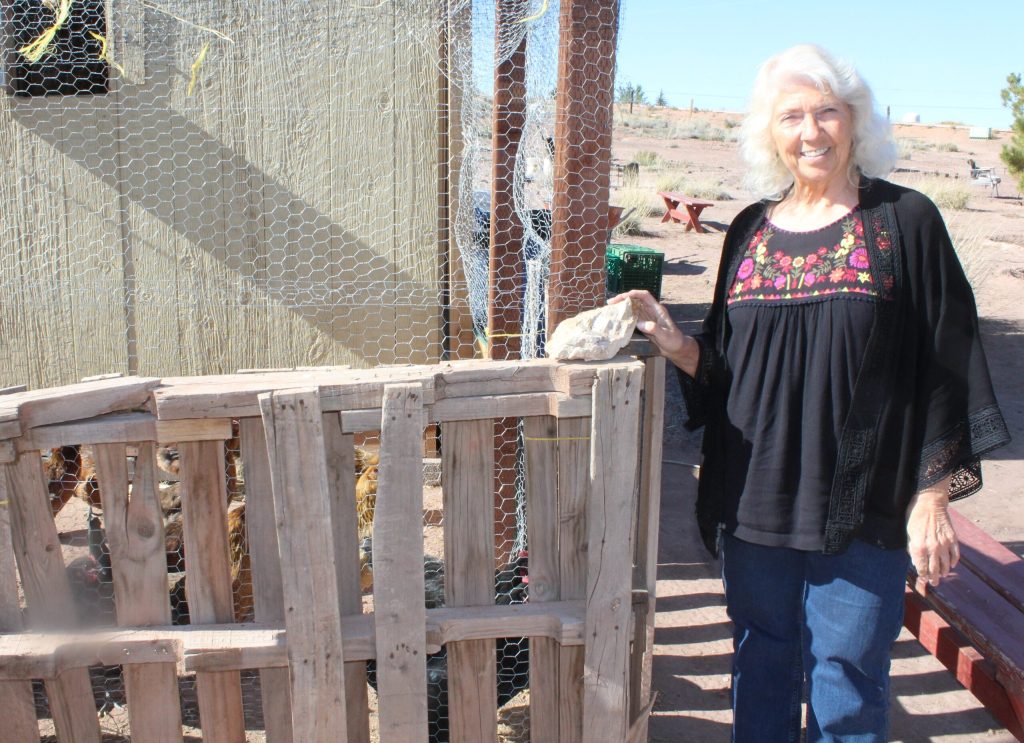 Photo by Toni GibbonsBread of Life Mission Executive Director Cherise Merrick stands in front of the new chicken coop that was completed this summer and currently houses 27 hens who lay eggs for the mission’s kitchen.