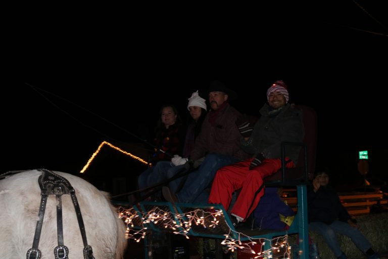 Photos by Linda KorHolbrook’s Business Man and Woman of the Year, Yvonne Larson (left) and Atsuo Sakurai (right) led the parade with Jason and Kay Hendricks (center) at the reins.