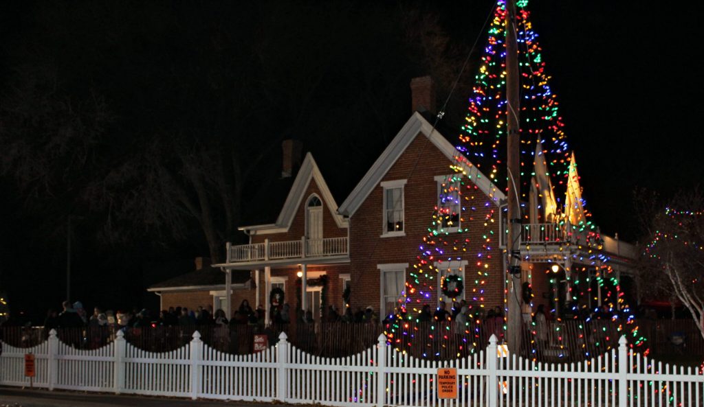 Photo by Toni GibbonsThe Snowflake Town Christmas tree shining brightly in front of the historic Freeman home.