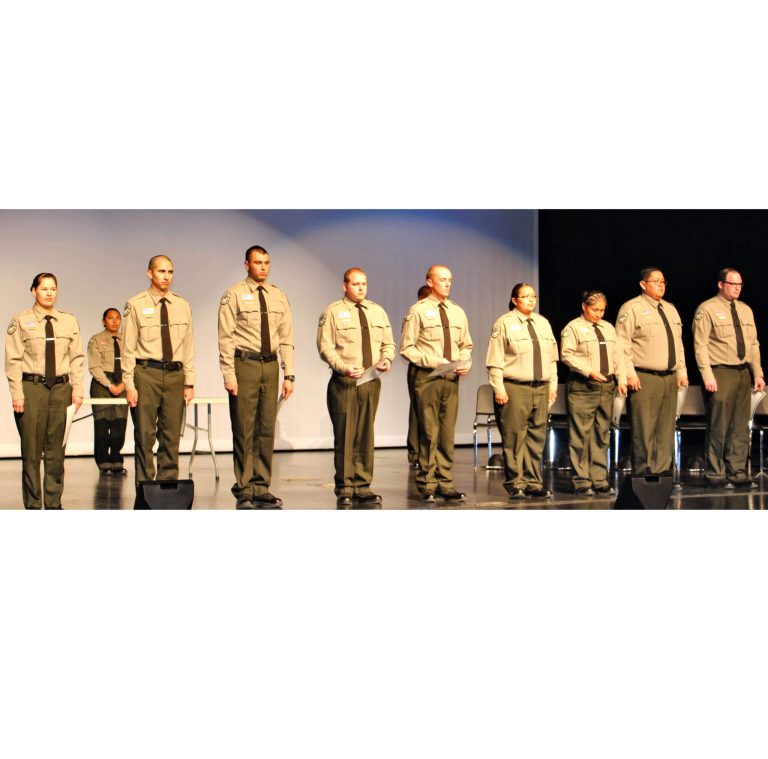 Photo by Toni GibbonsCadets from Class 104 stand at attention waiting for their person to come and pin them during the graduation ceremony on Dec. 6. Pictured (left to right) are Tessia Roanhorse, Fernando Ochoa, Brady Nowell, Tyler Gould, Jeffrey Brown, Donna Yazzie, Christine Yazzie, Clayton Yazzie and Christopher Stapley.