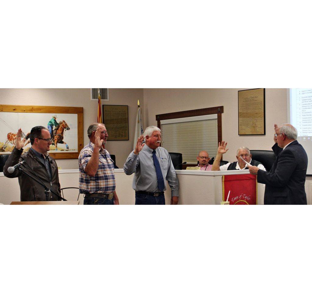 Photo by Toni GibbonsJustice of the Peace Judge Fred Peterson (right) swore in the newly-elected and re-elected council members at the Taylor Town Council meeting on Dec. 6. Pictured are (left to right) Jason Brubaker, Bill Baldwin, David Smith, Kyle Peck and Carl Cosper.