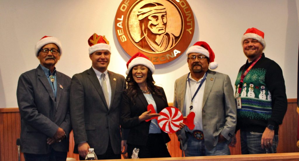 Photo by Toni GibbonsThe Navajo County Board of Supervisors donned the Santa hats provided by Supervisor Jason Whiting (right) to pose for a final holiday picture in 2018. Vice Chairwoman Dawnafe Whitesinger (center) is holding the Candy Land Award that Navajo County won at the Holbrook Parade of Lights for the Best Theme. Also pictured are (left to right) Supervisor Jesse Thompson, Chairman Steve Williams and Supervisor Lee Jack Sr.